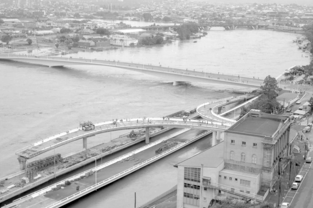 Aerial view of the Brisbane River and Victoria Bridge during the 1974 flood, January 1974