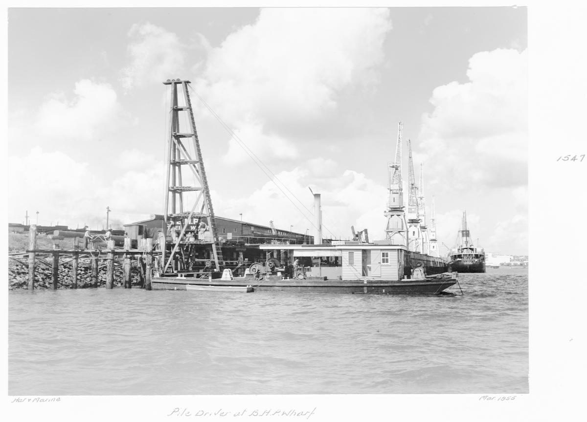 Pile driver at BHP Wharf, Brisbane River - March 1955
