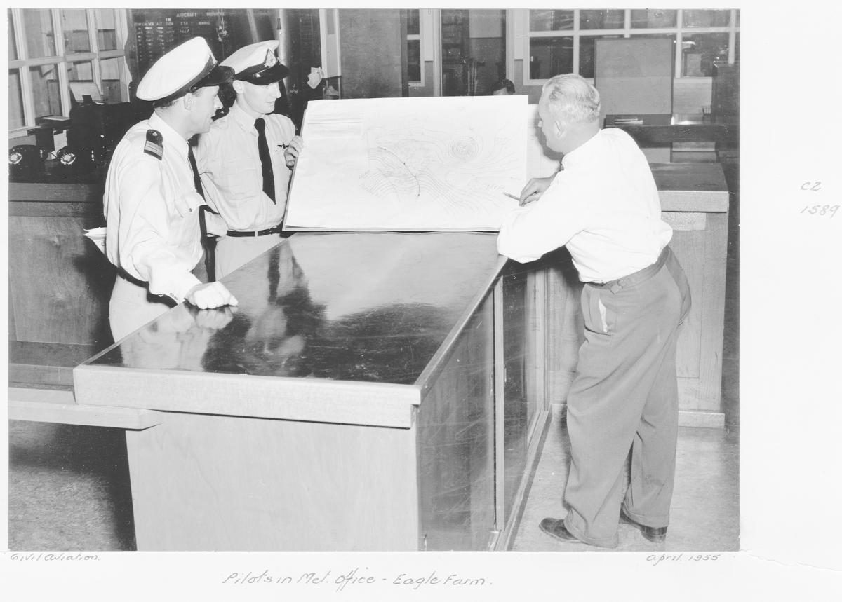 Civil Aviation pilots in metropolitan office, Eagle Farm - Brisbane, April 1955