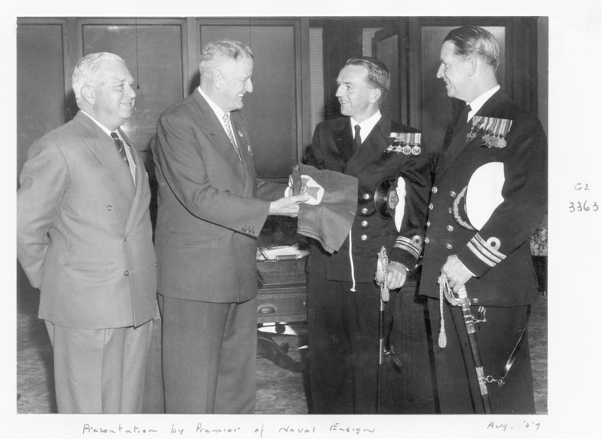 Presentation of naval ensign by Queensland Premier Mr G F R Nicklin - Brisbane, August 1959