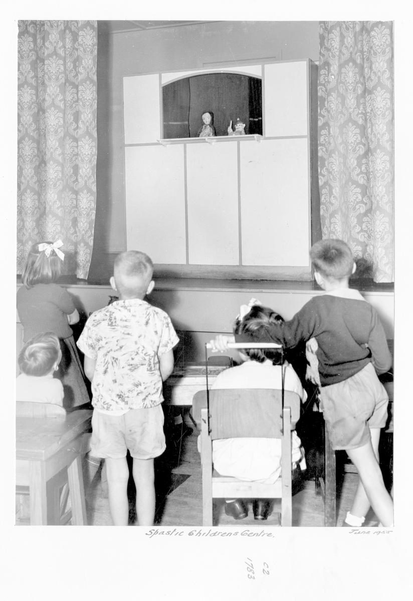 Children watching puppet show at the Spastic Children's Centre - Brisbane, June 1955
