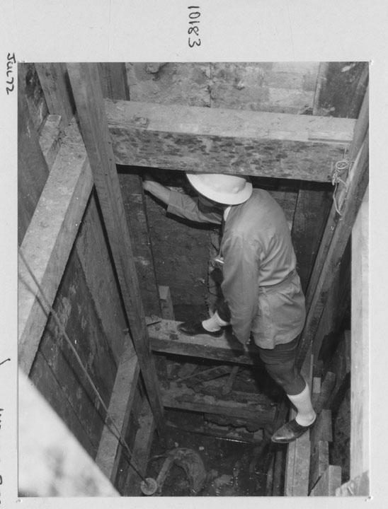 Construction of the State General Insurance Office (SGIO) building - Pier hole shoring being checked - Brisbane, July 1972