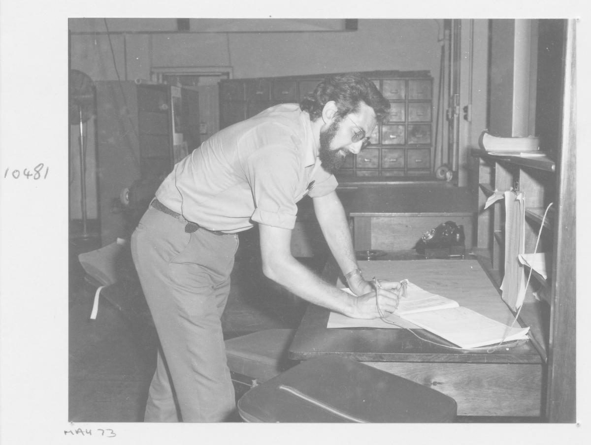 Jean Louis Fougerouse signing day book at the Survey Office Photo Section - Brisbane, May 1973