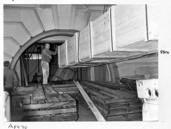 Camera main beam being unloaded and directed through the window opening, William Street, Brisbane, April 1970