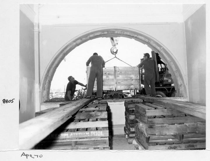 Camera main beam being unloaded and directed through the window opening, William Street, Brisbane, April 1970