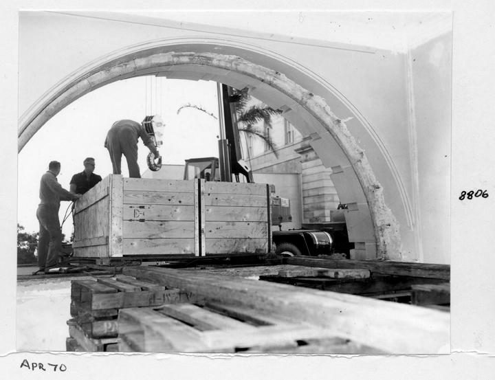 Camera main beam being unloaded and directed through the window opening, William Street, Brisbane, April 1970