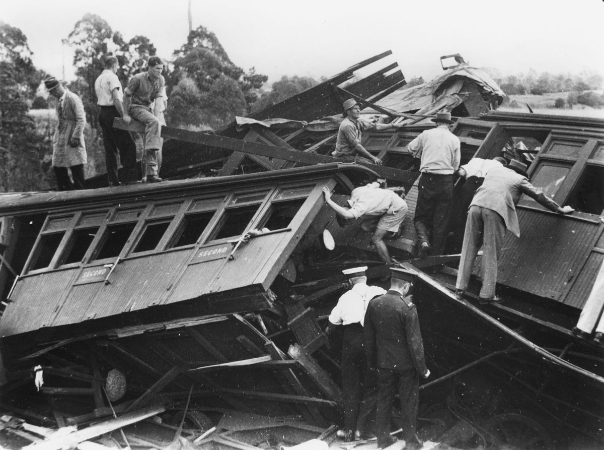 Rescuers inspect the wreckage of the Camp Mountain train disaster, 1947