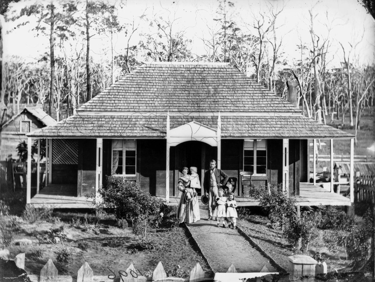 Family standing outside their homestead in the Albert and Logan district, 1872