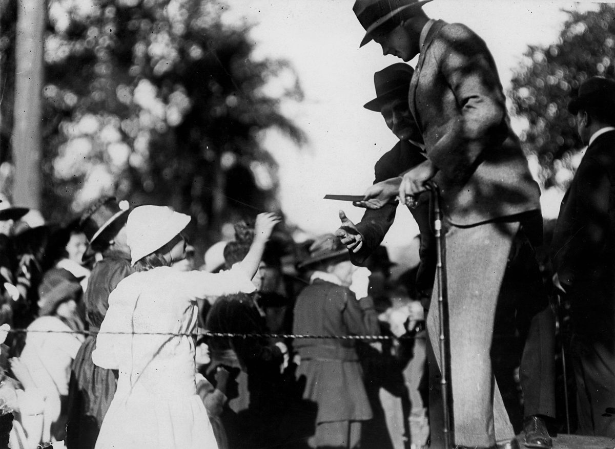 Edward, Prince of Wales receiving a gift from an admirer at the People's Reception in Brisbane in July 1920