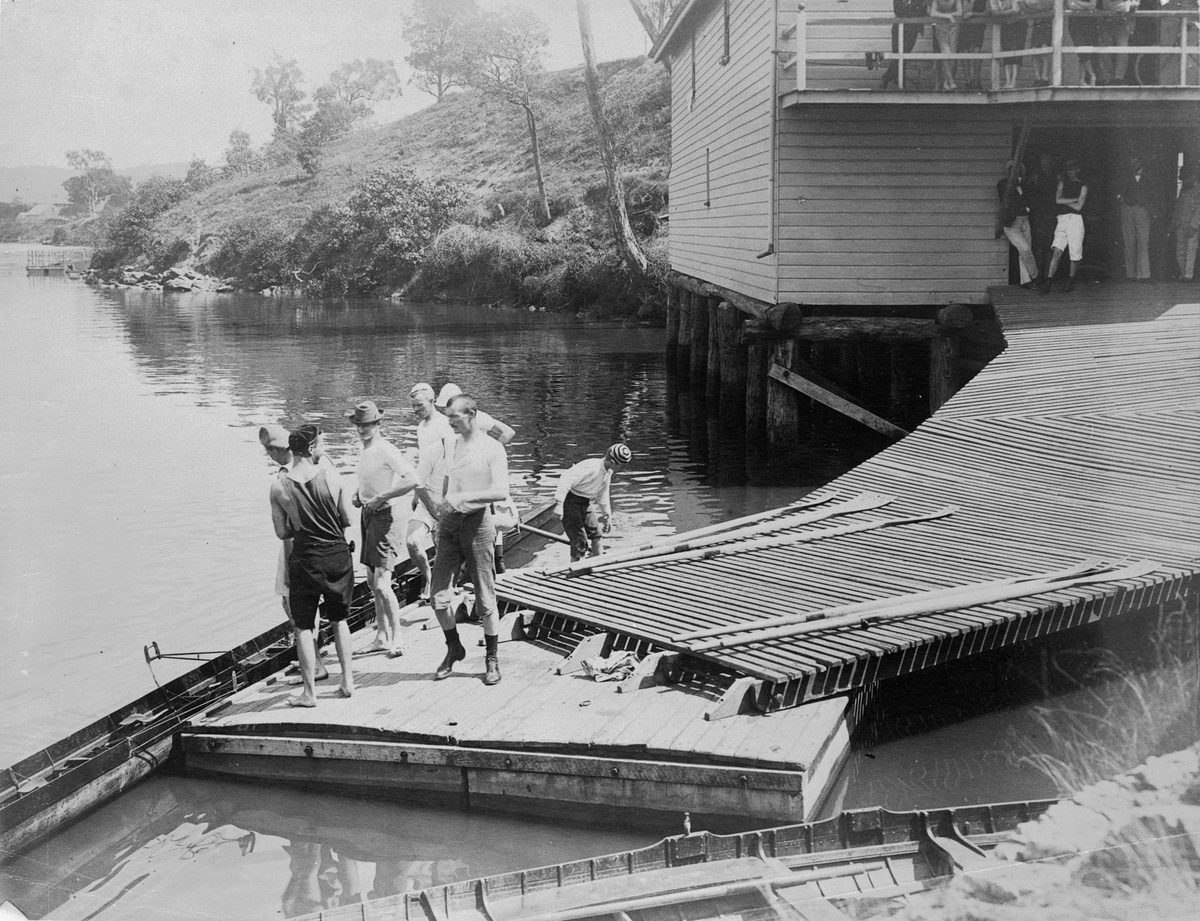 Rowers standing on the pontoon near the Brisbane Rowing Club in 1897