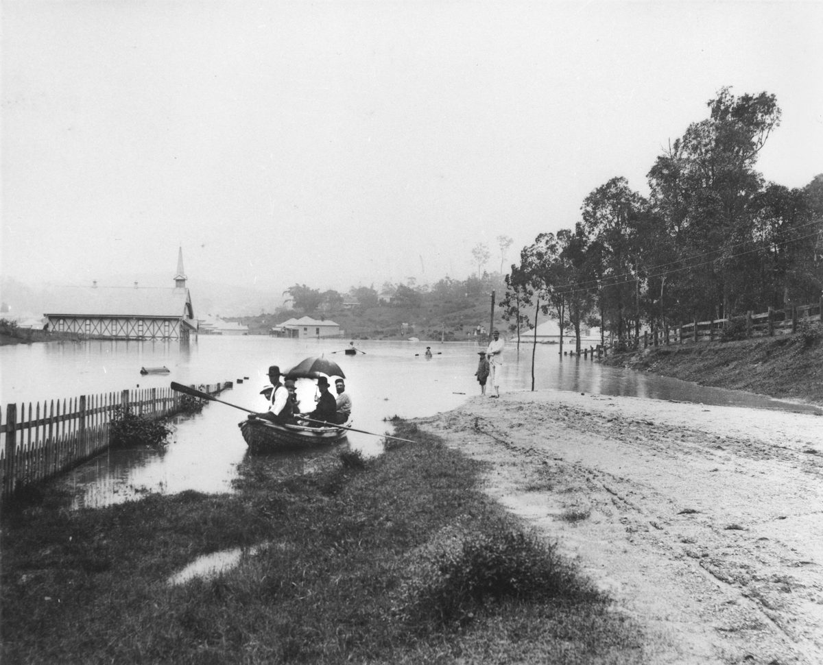 Group of men sitting in a rowing boat during the Brisbane Floods, 1890