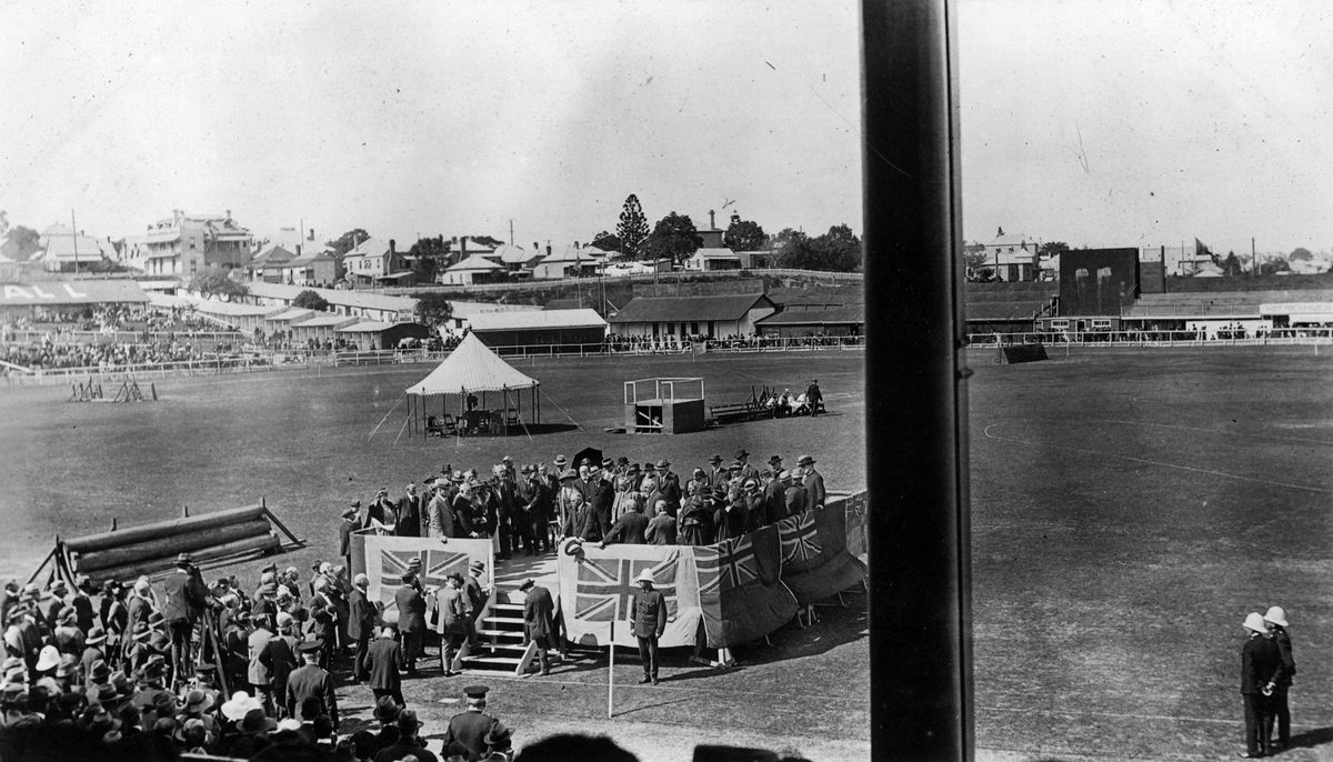 Official dais draped with flags and filled with guests, Showground, Brisbane, 1921
