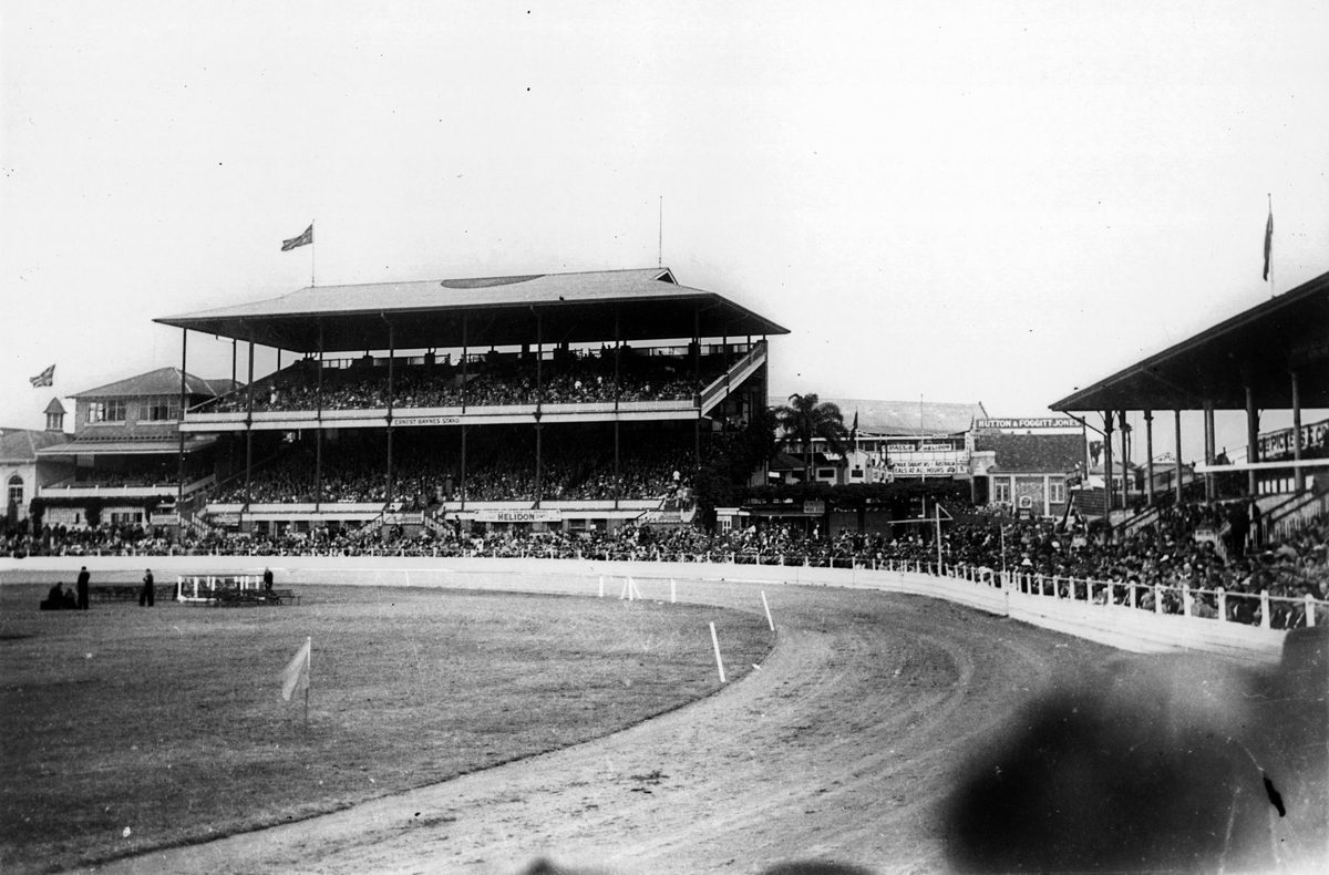 Crowds fill the grandstands and perimeter of the main show ring to watch events at the RNA Show, Brisbane 1948