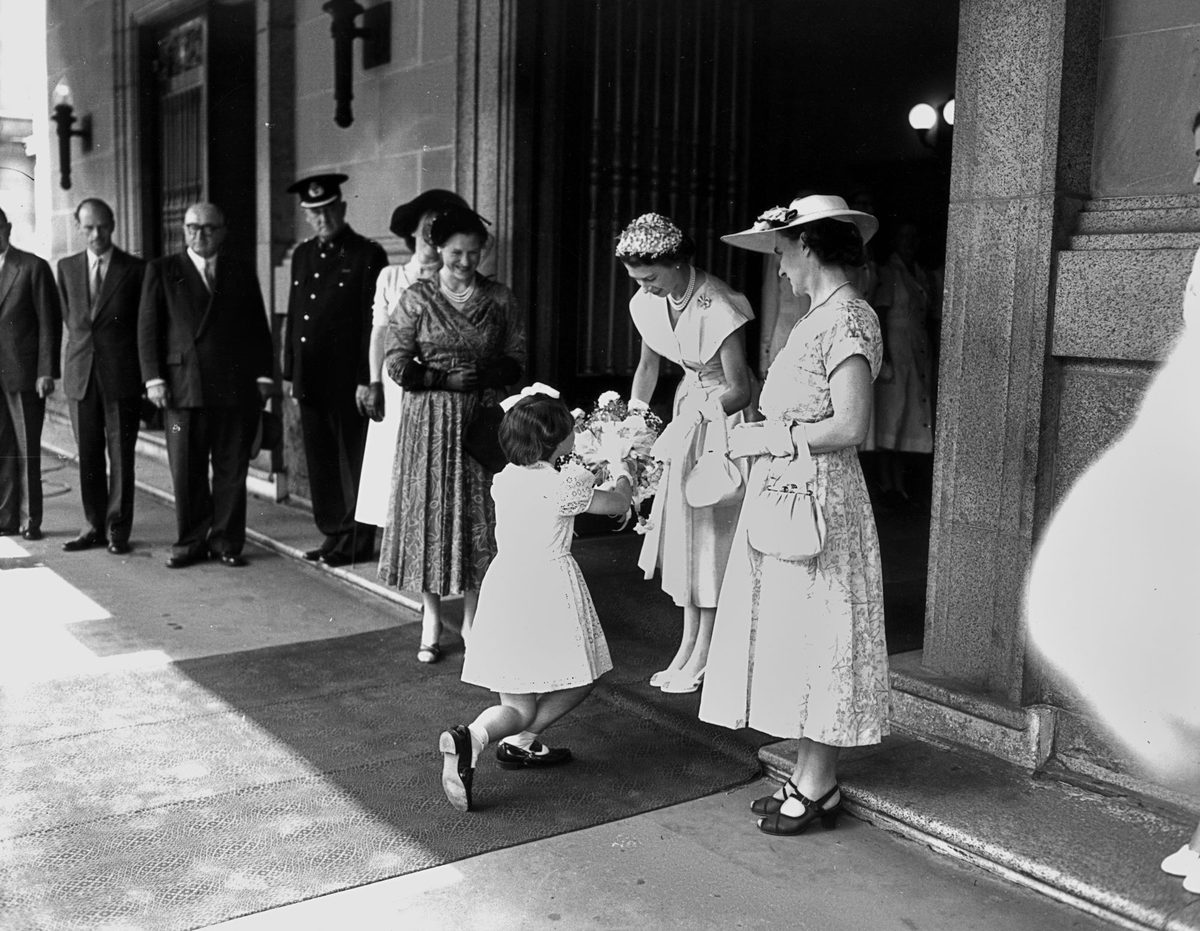 Presenting flowers to The Queen outside Brisbane City Hall in March 1954
