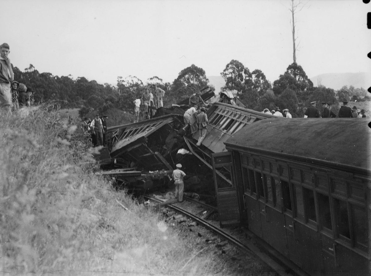 Derailed railway carriages at Camp Mountain, 1947