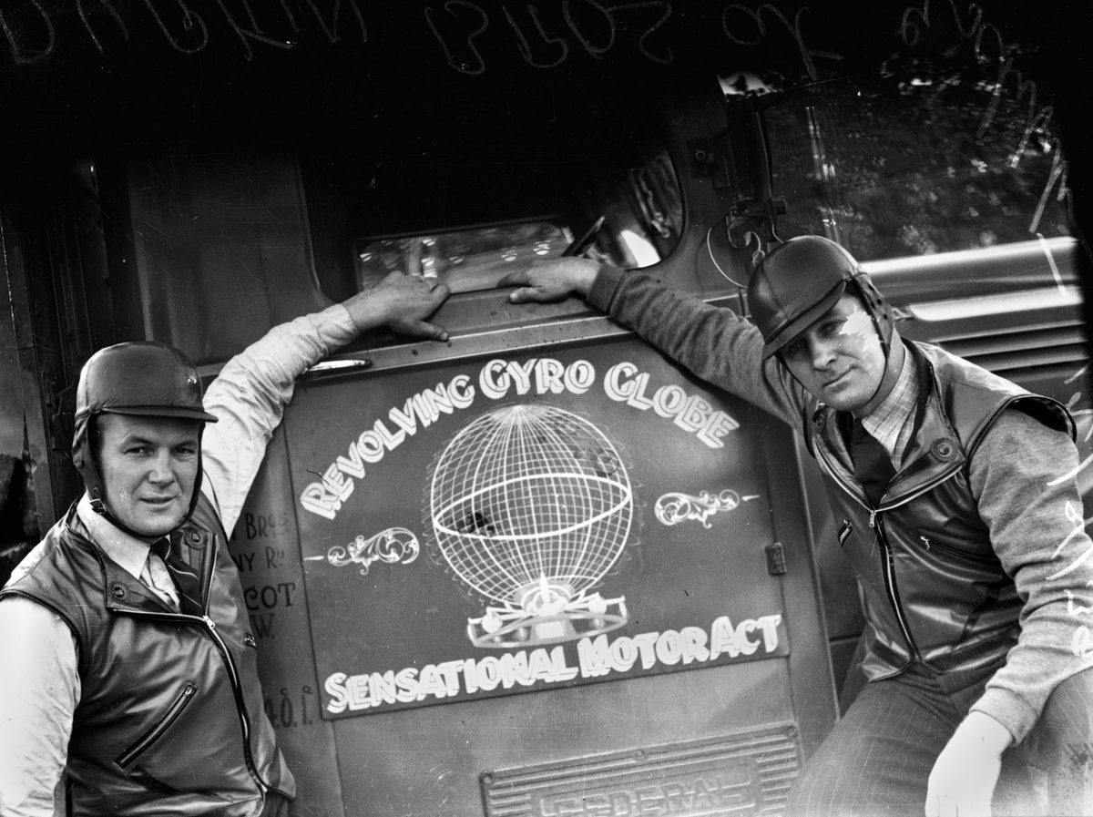 Helmeted drivers from the Revolving Gyro Globe Sensational Motor Act at Brisbane's Exhibition Ground, 1939