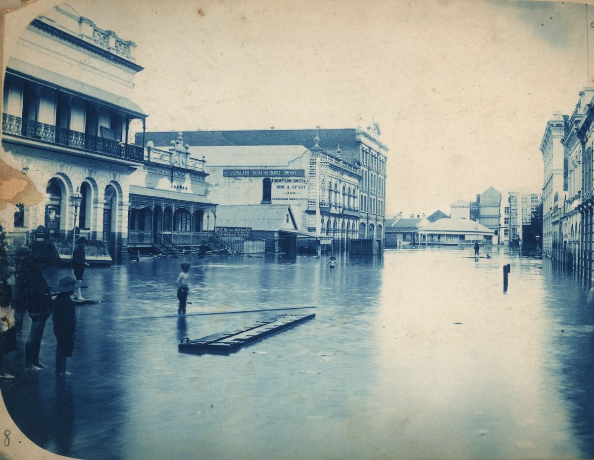 Children standing in floodwaters in Eagle Street, Brisbane, 1893