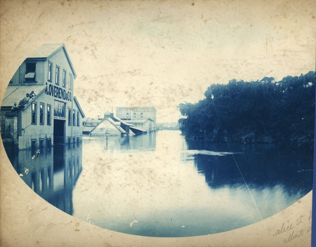 Floodwaters rise in Alice Street, almost covering the first floor of Overend's building, Brisbane, 1893