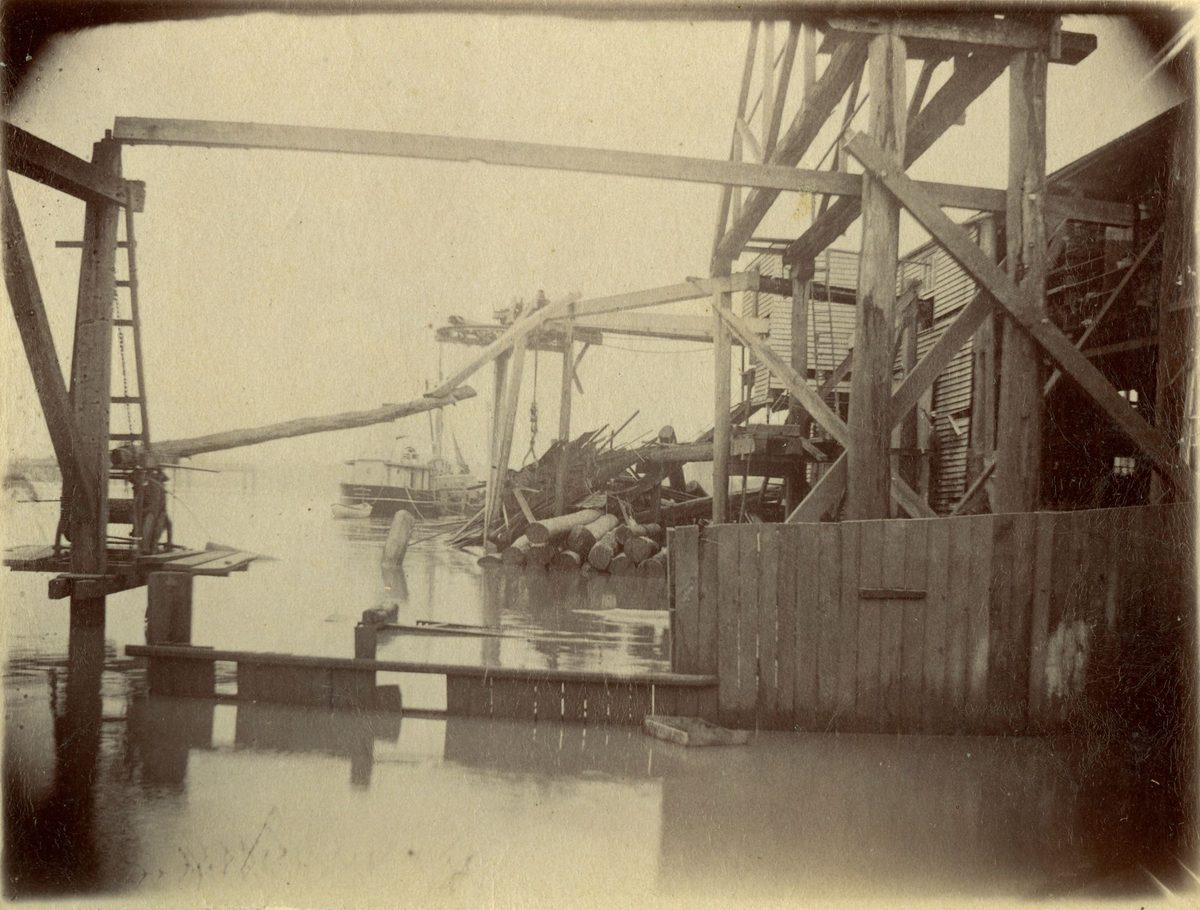 Boats plying in and out of the debris left by the 1893 floods
