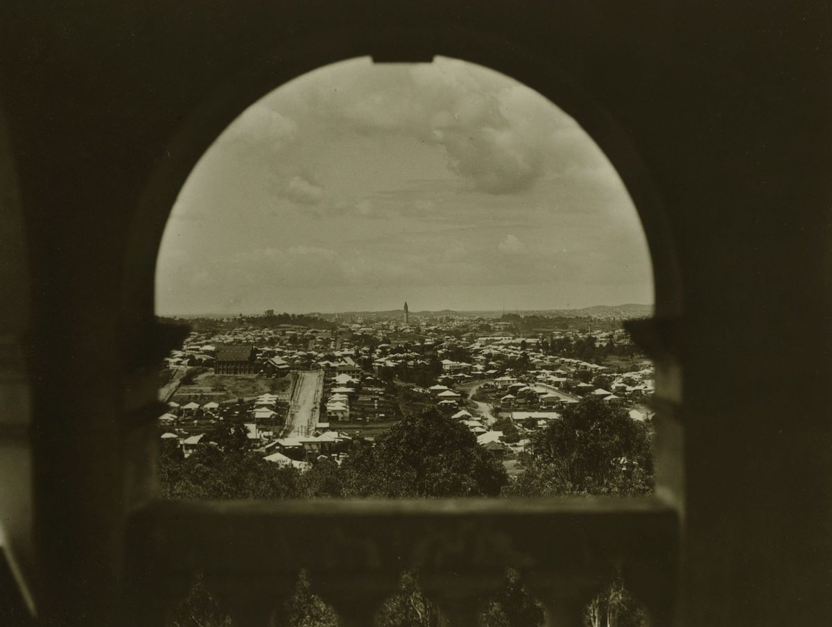 Looking towards Red Hill from a feature window in a wall at Government House, Brisbane, 1932