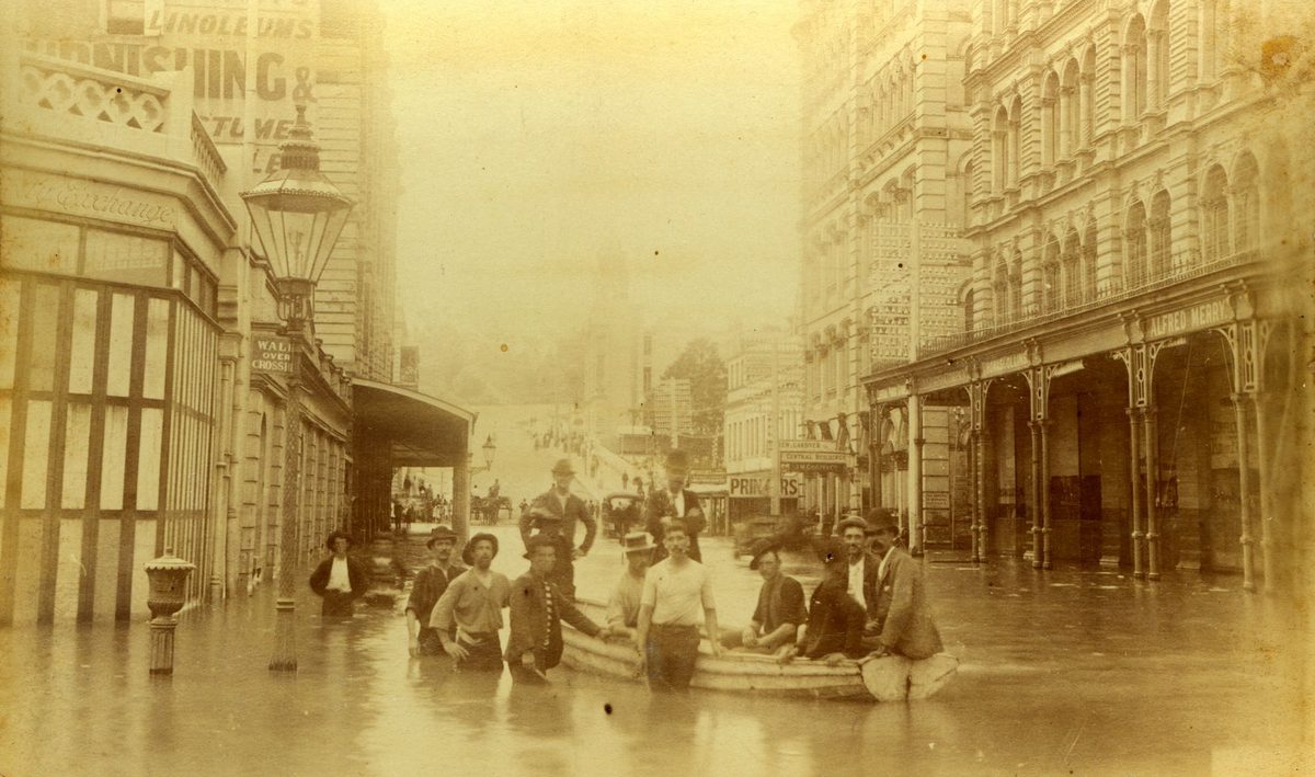 Wooden boat being used to ferry pedestrians in Brisbane's 1893 floods