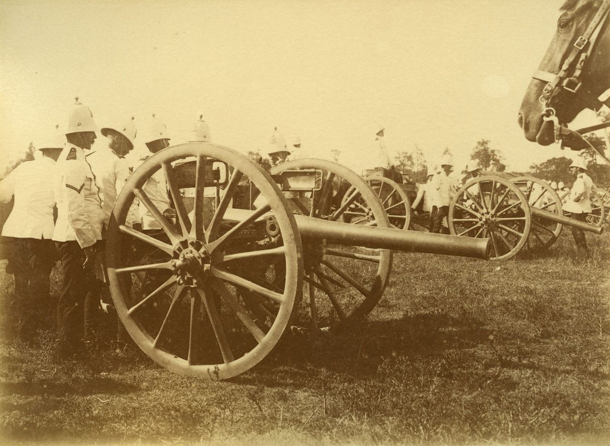 Soldiers preparing to fire the cannons at a military display in the Domain, Brisbane, 1901