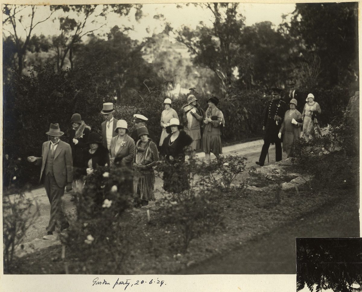Sir John Goodwin and guests at a garden party in the grounds of the Governor's residence