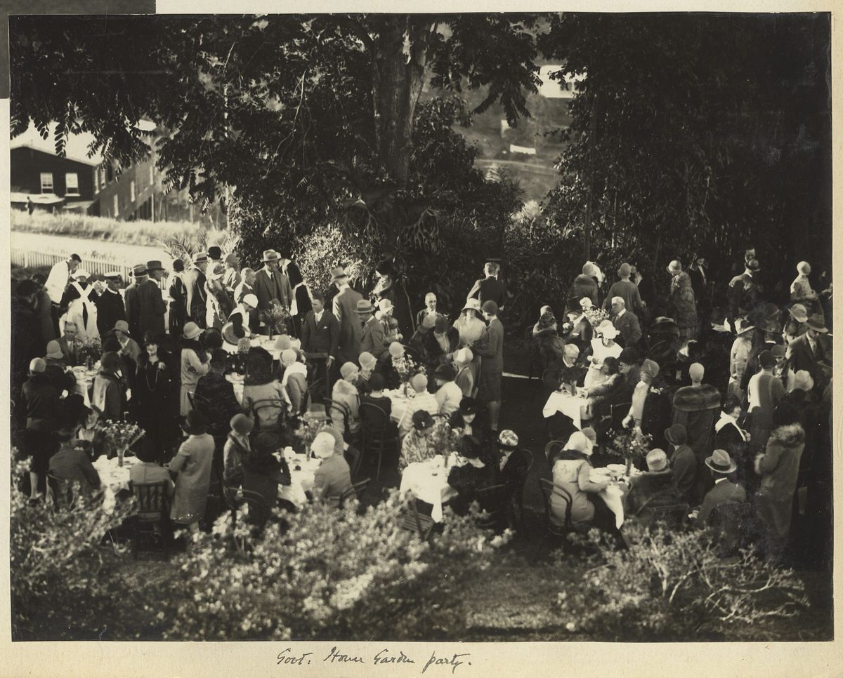 Eating outdoors in the grounds of Fernberg at the Queensland Governor's Garden Party, June 1929