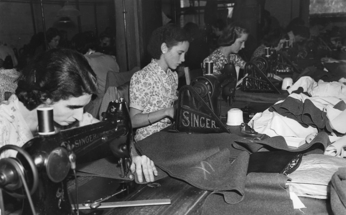Women sewing military uniforms in Brisbane.