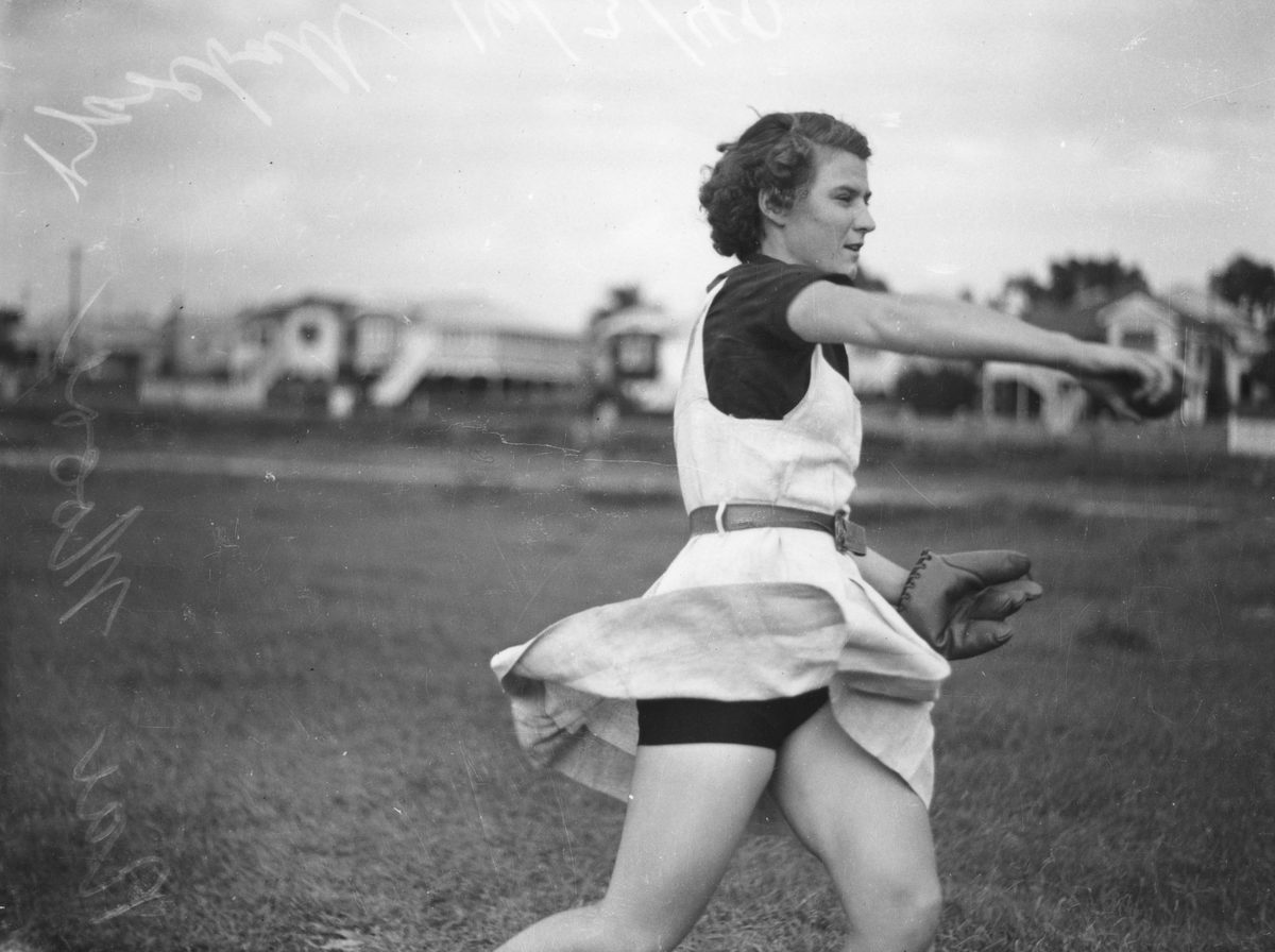 Female baseball player in action on the field, Brisbane, 1940