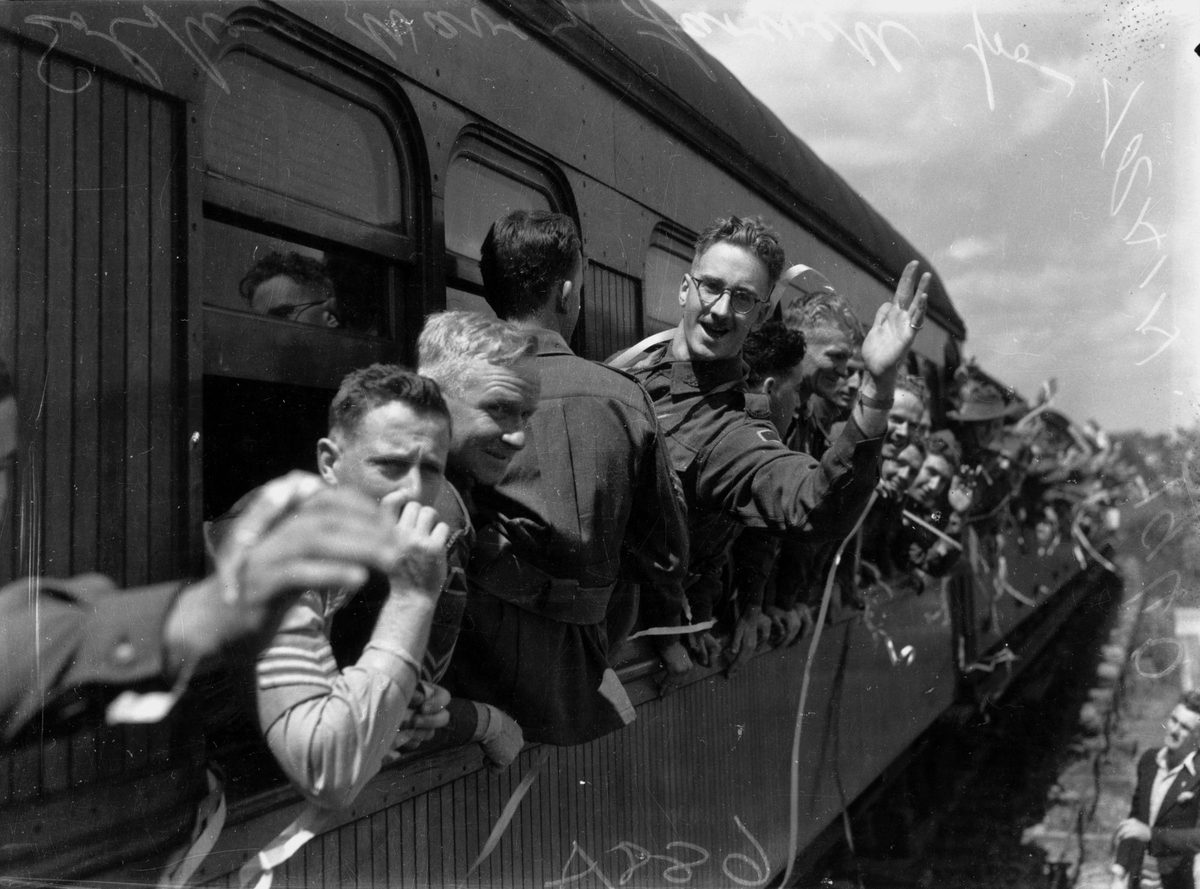 Soldiers waving farewell from the train, Brisbane, 1940