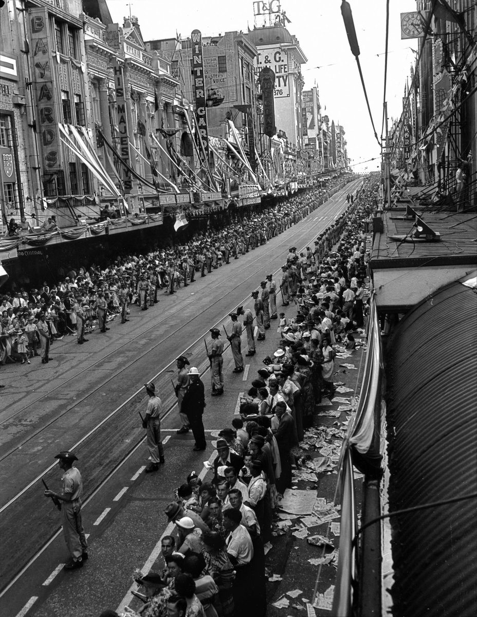 View of the crowds in Queen Street, Brisbane, awaiting Queen Elizabeth II and Prince Philip in March 1954