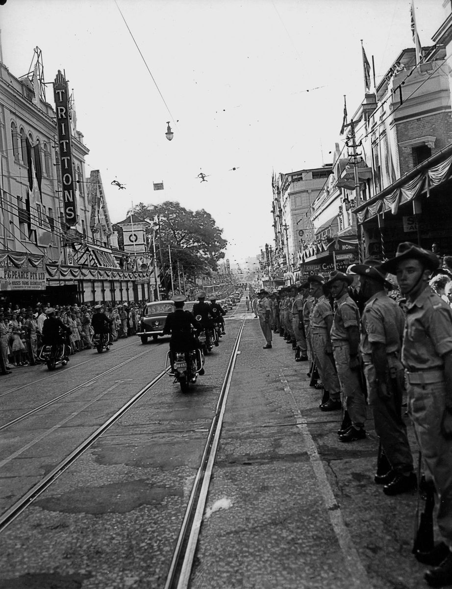 Soldiers line George Street in Brisbane for the Royal Motorcade passes, March 1954