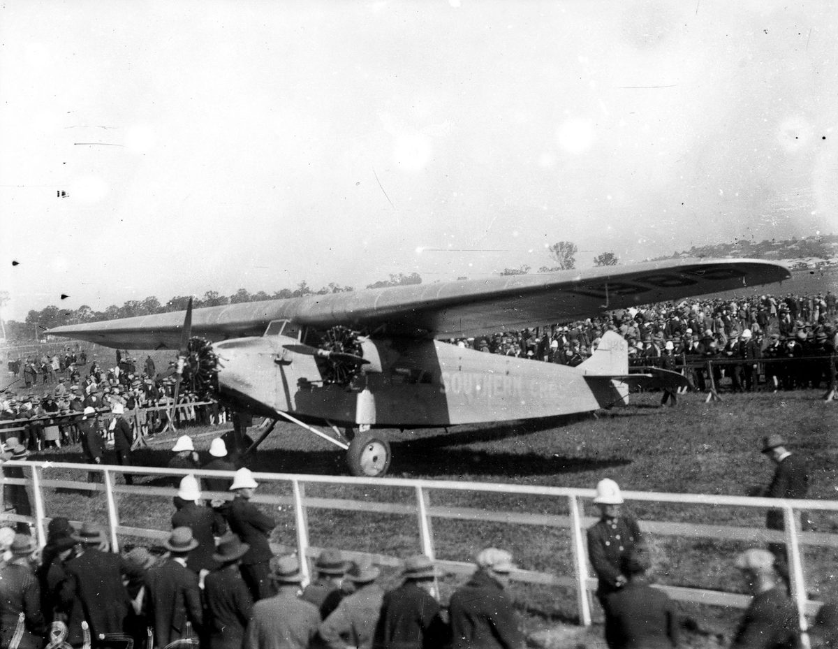 Southern Cross, a Fokker F.VII 3m aeroplane, on display in an enclosure at the airfield, June 1928