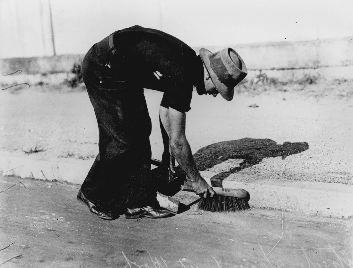 Street cleaner at work, 1934