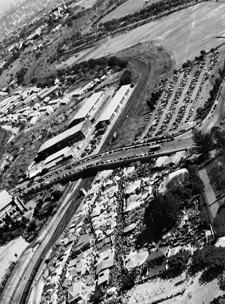 Aerial view of the Exhibition Ground, showing Sideshow Alley and parking area during Ekka time, Brisbane, 1946