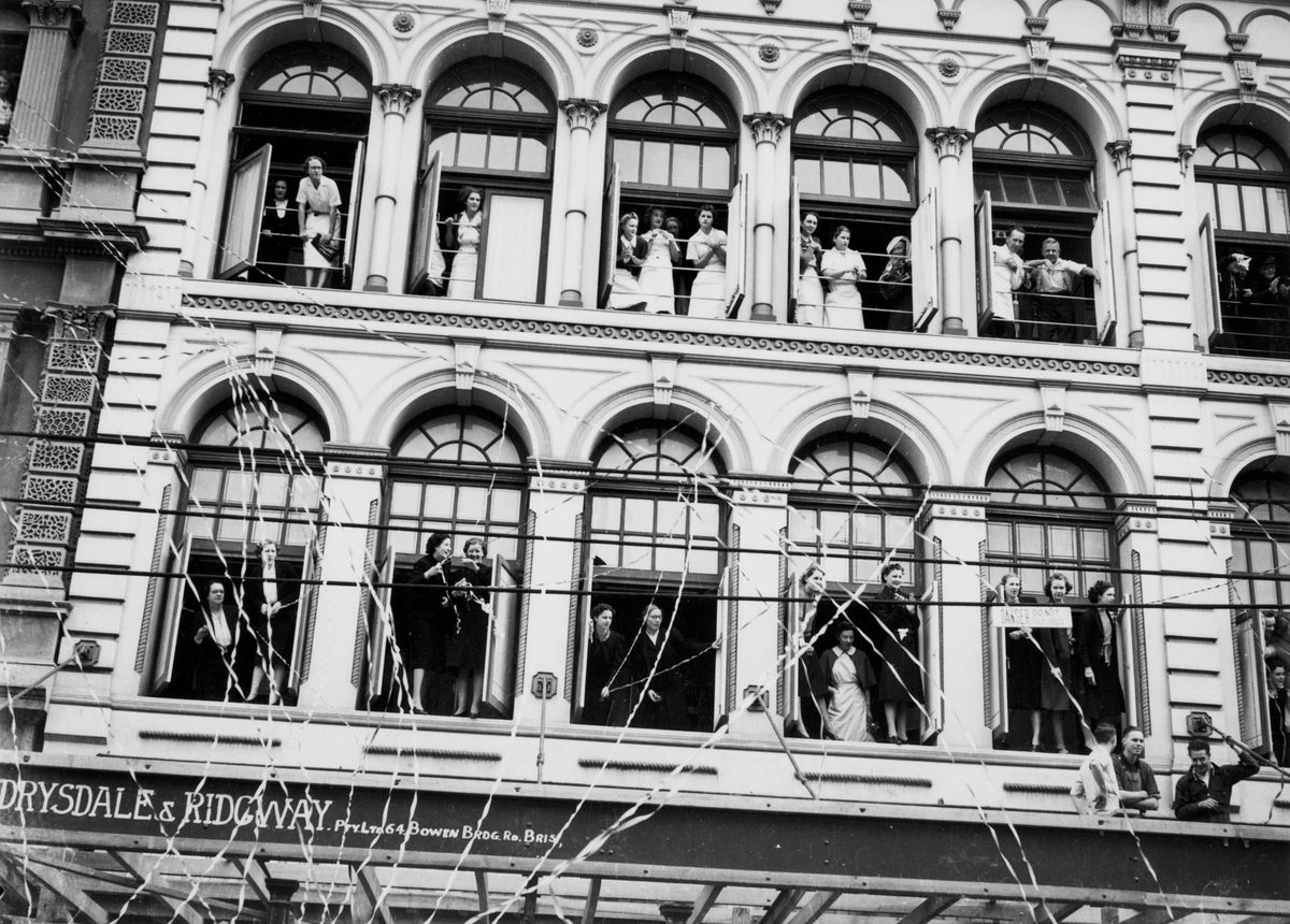 Shop girls applauding RAAF recruits marching along Queen Street, Brisbane, 1940