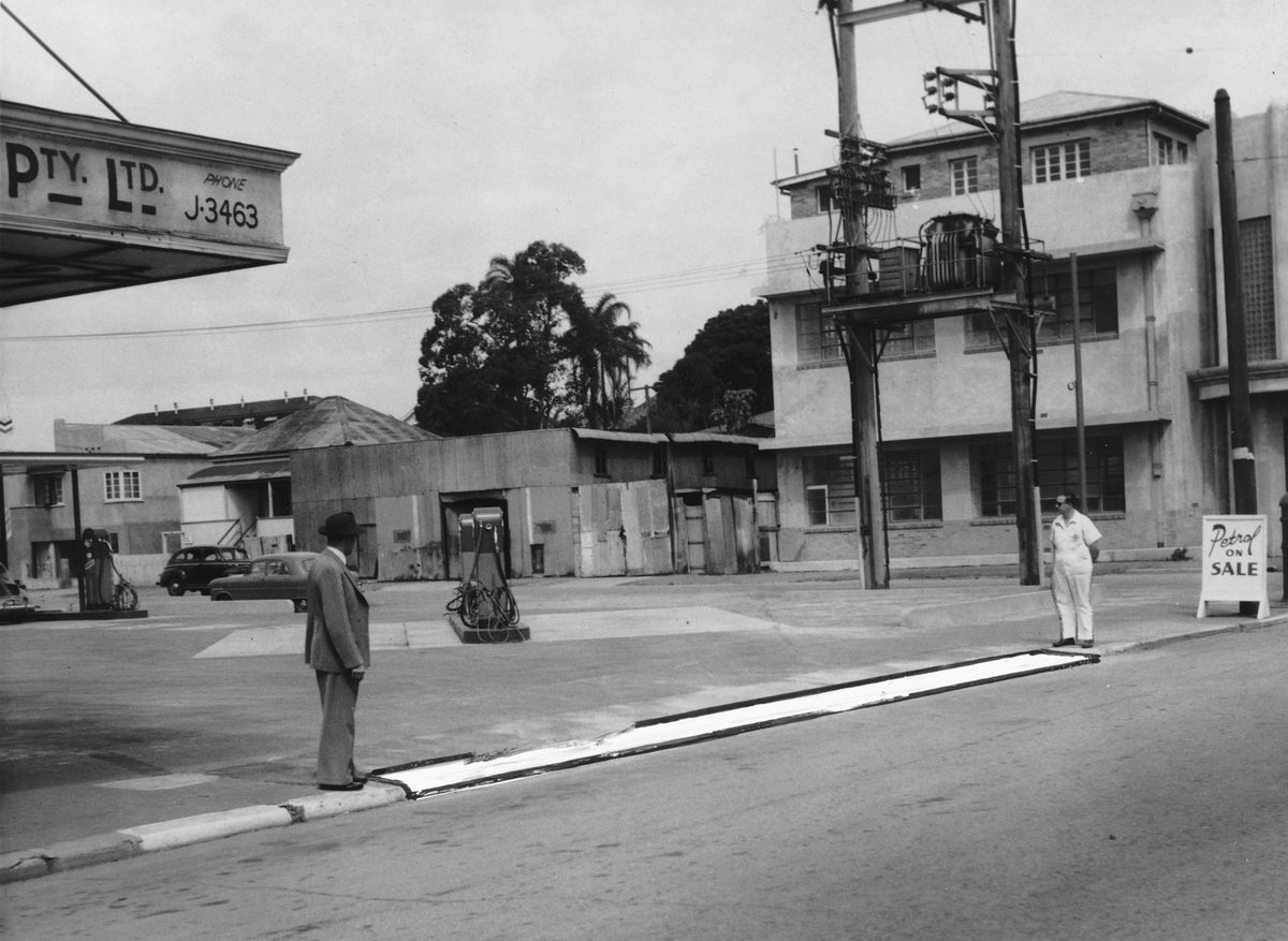 Outside a service station in Melbourne St, South Brisbane, 1953