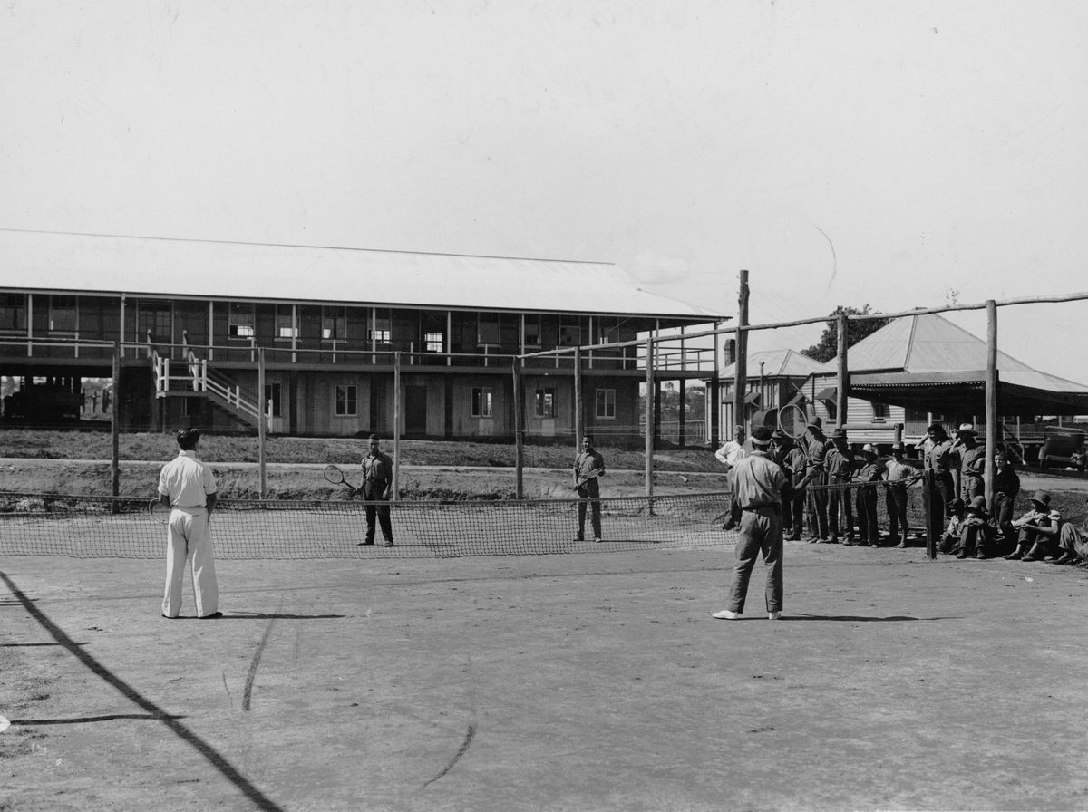 Playing tennis at the Farm Training School, St. Lucia, Brisbane, 1936