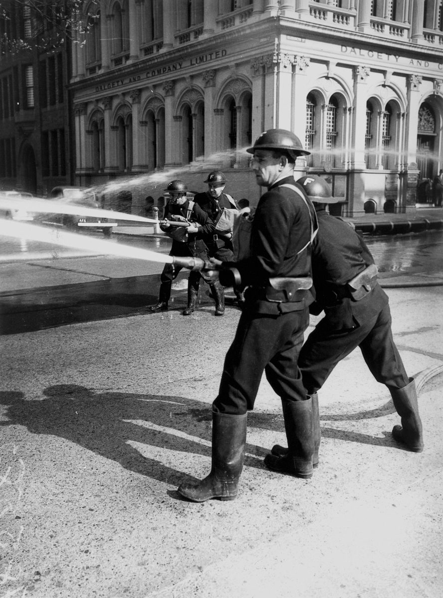 Firemen checking water pressure in the salt water mains, Brisbane, September 1942