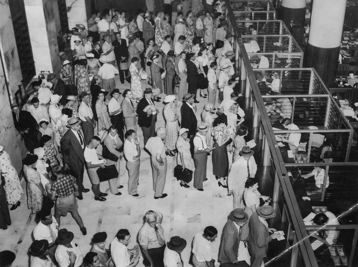 Customers waiting for service at the Commonwealth Bank, Brisbane, January 1953