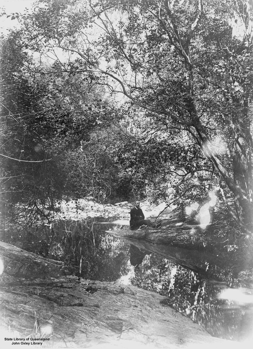 Man resting on a log on Mt Coot-tha, 1893