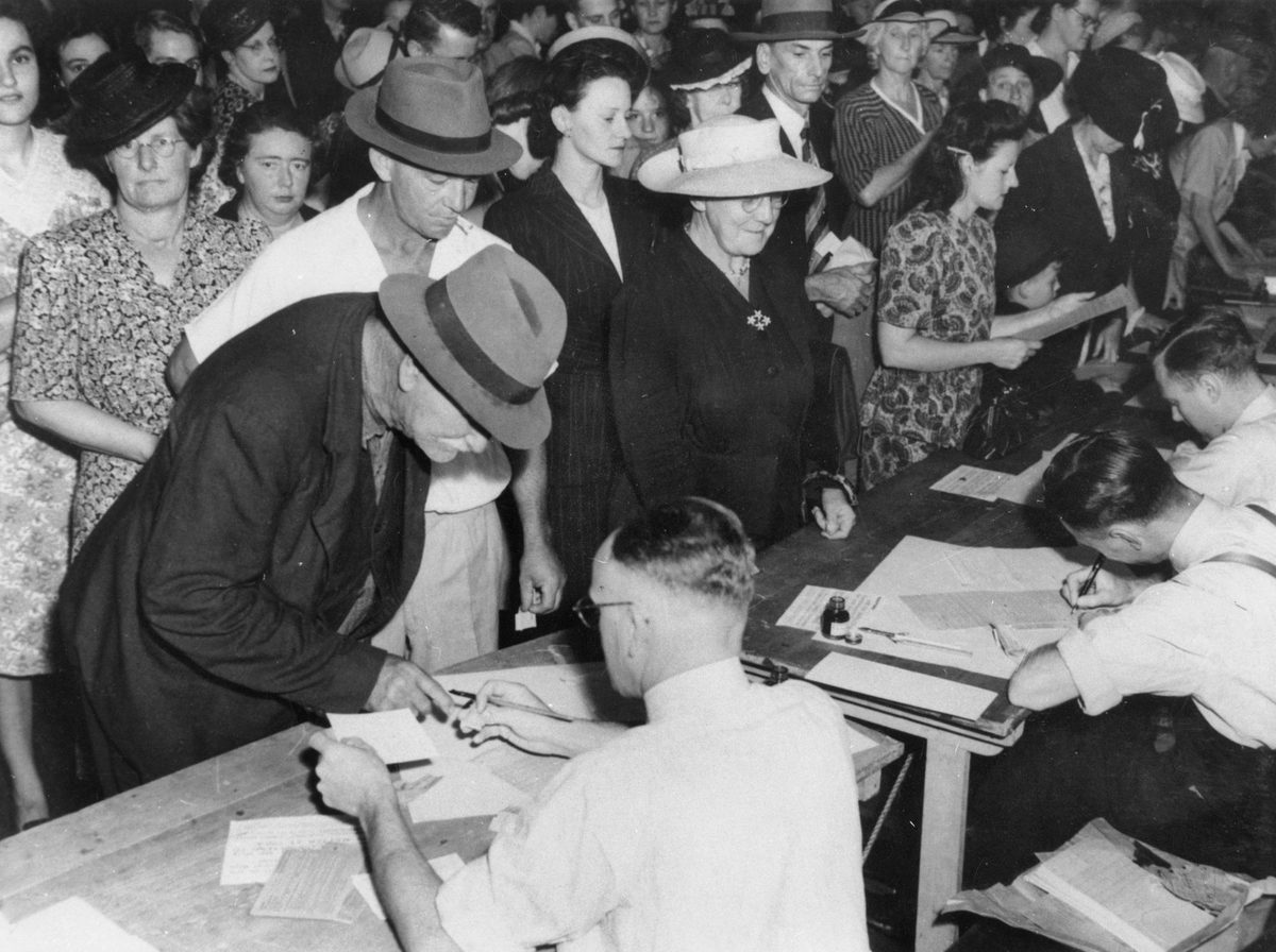 Crowd queuing for rationing cards, 1947