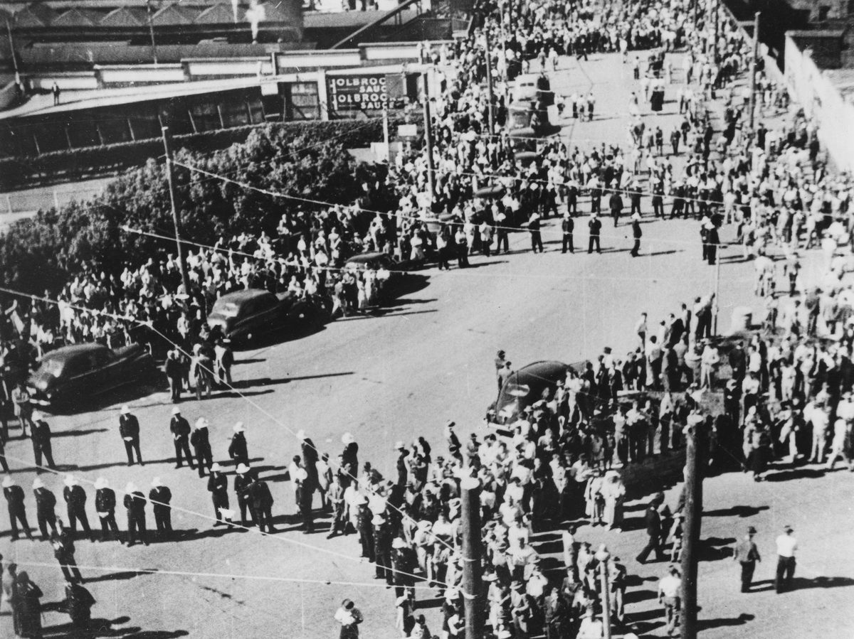 Crowds and police in Edward Street infront of the Trades Hall during the Railways Strike, Brisbane, 1948