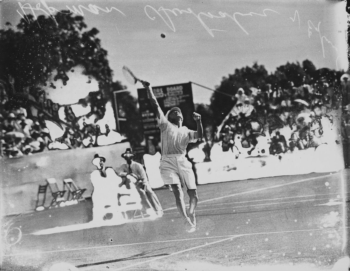 Australian Harry Hopman going for an overhead smash against England, Brisbane, 1931
