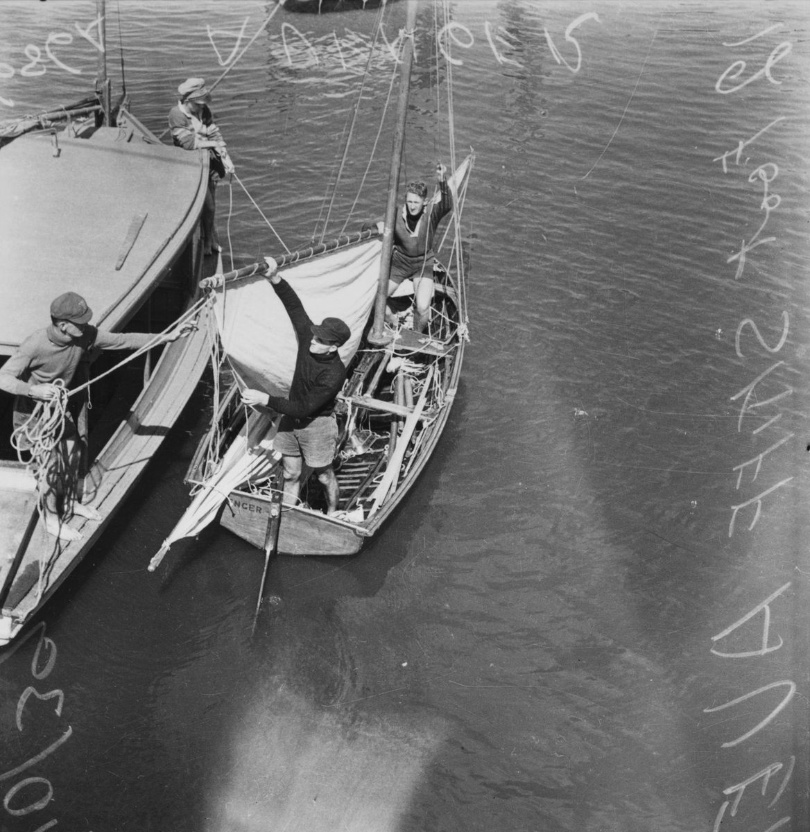 Crew on the twelve footer skiff Avenger, 1939