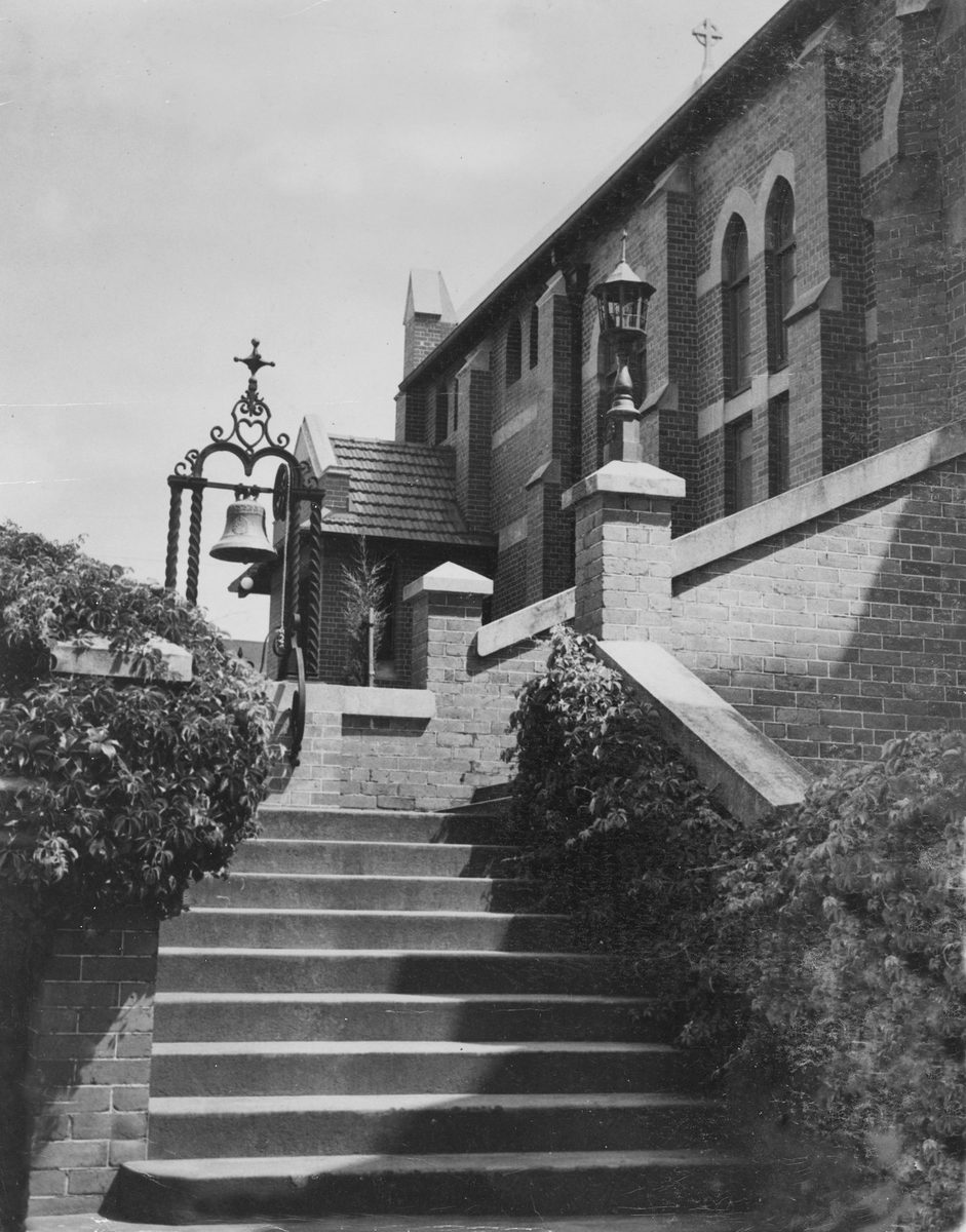 View of steps and a bell at St. Augustine's Church in Hamilton, 1938