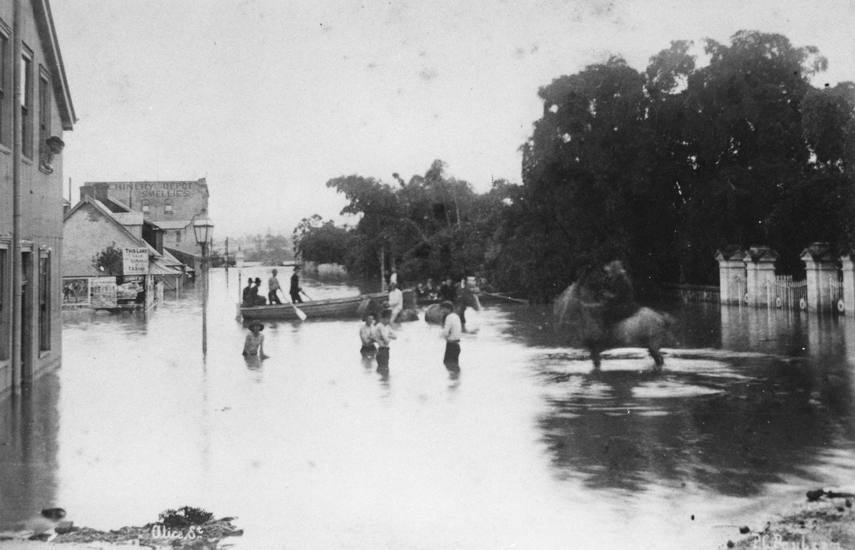 People in the flood waters at the corner of Alice and Albert Streets, Brisbane, 1890