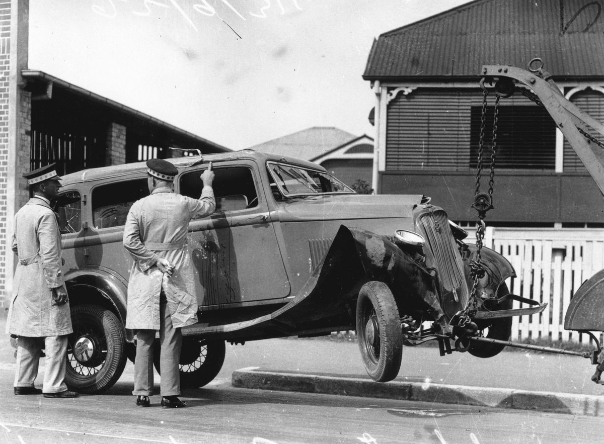 Tow truck moving a 1933 Continental Sedan