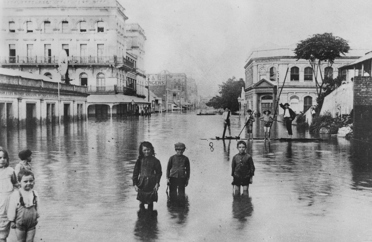 Children in the floodwaters in Adelaide Street. 1893